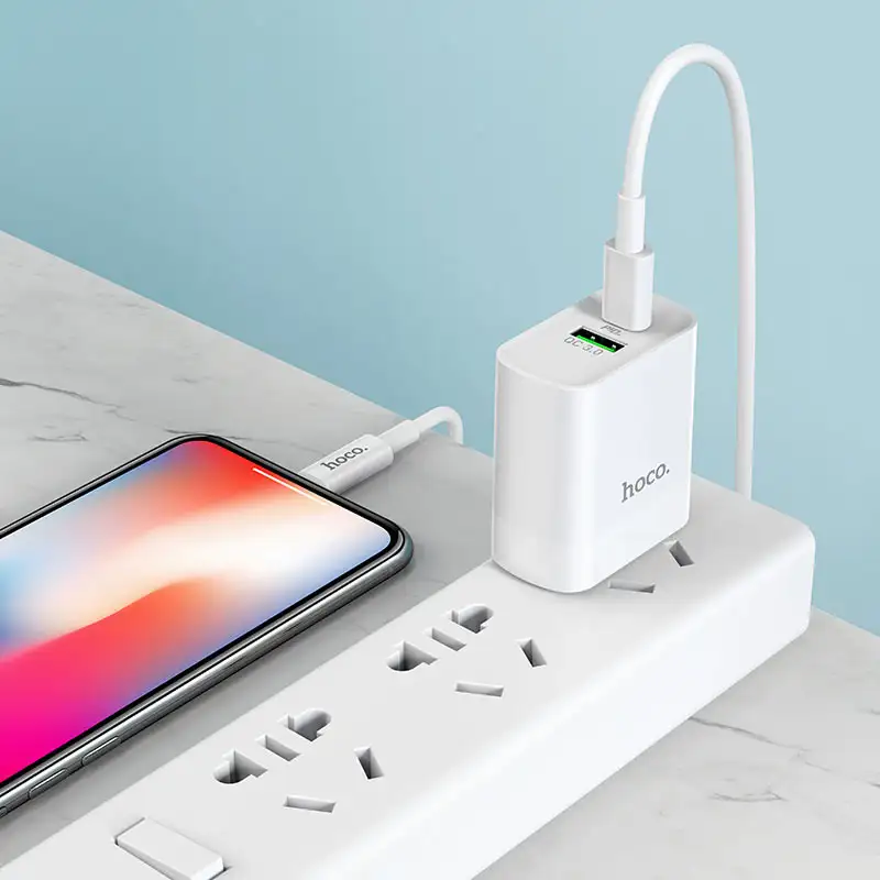 A clean studio shot of the HOCO C80 fast charger 18W dual port adapter