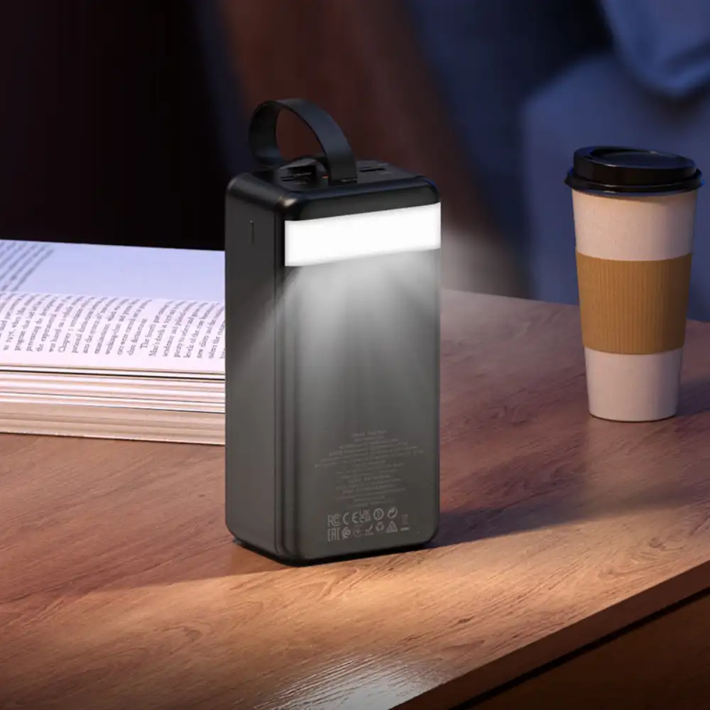A lifestyle power-on image with the J123C charging multiple devices at once—smartphone,
