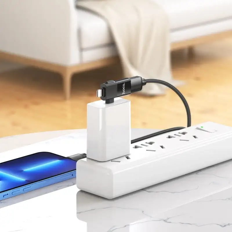 A lifestyle image showing the adapter connected to a smartphone and USB device,