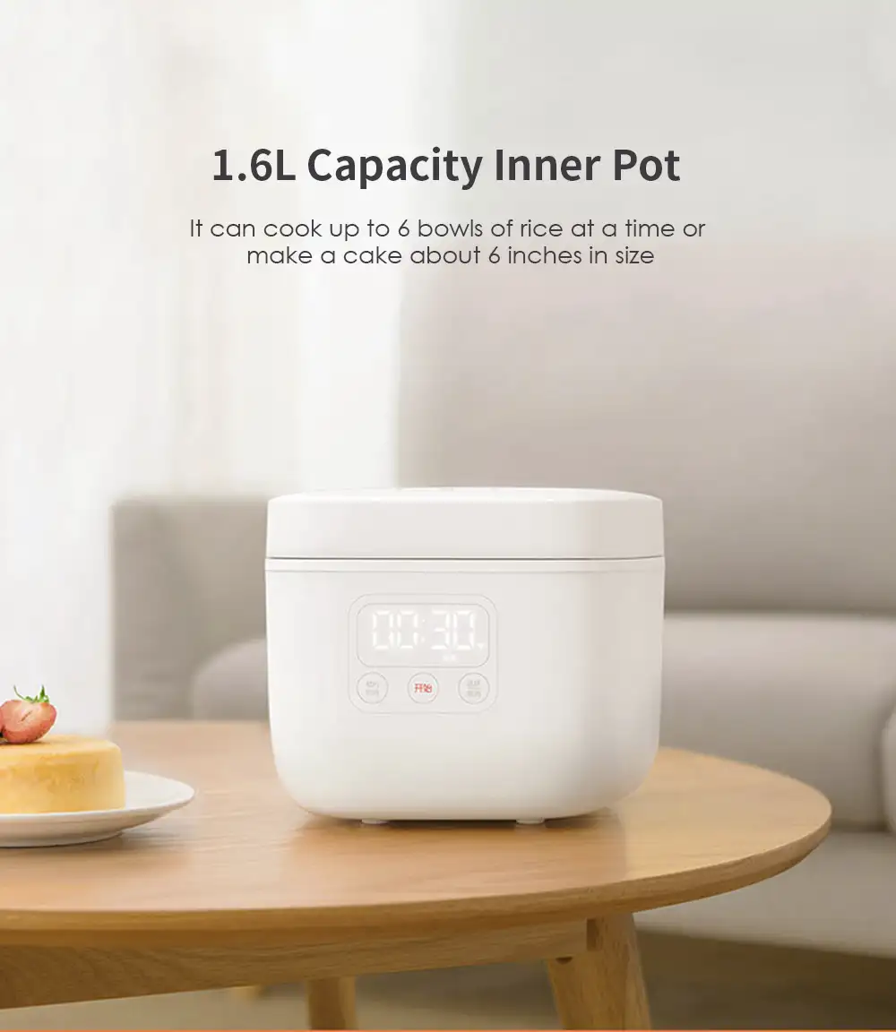 A kitchen scene with the rice cooker open and perfectly cooked rice inside