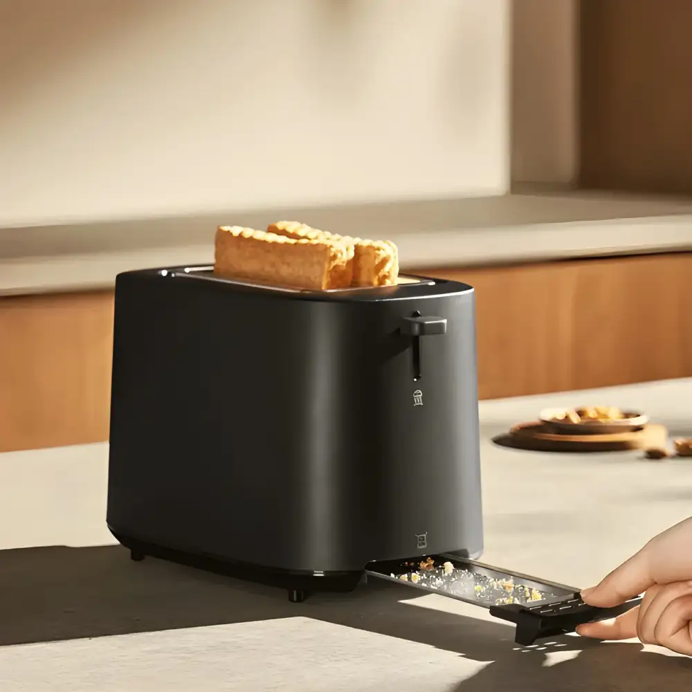 A lifestyle image of a family enjoying breakfast with the Xiaomi toaster on a kitchen counter in Bangladesh