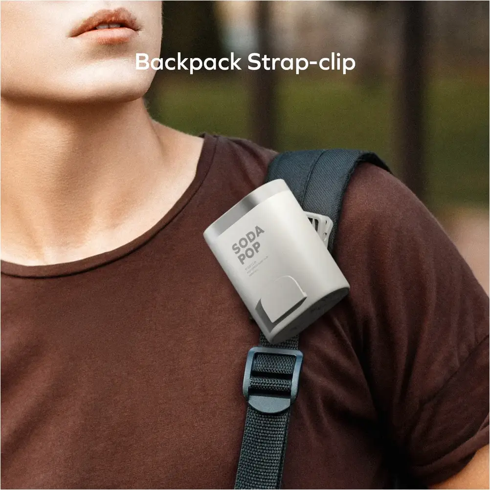 Momax 40000RPM Clip-on Mini Fan attached to backpack for outdoor cooling